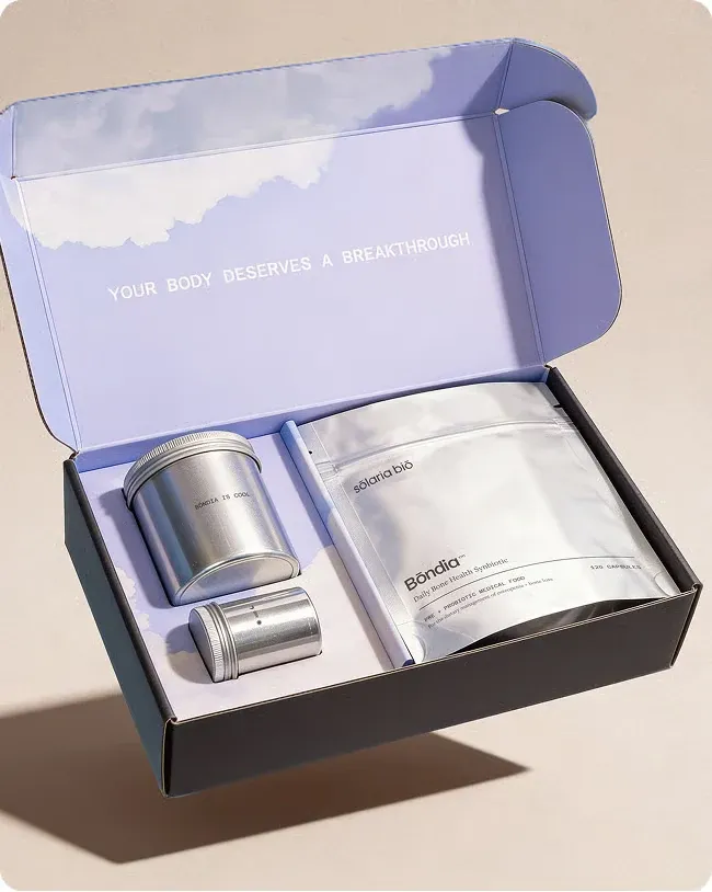 Bōndia Bone Health Synbiotic pouch and refill tins in an open Sōlaria Biō box