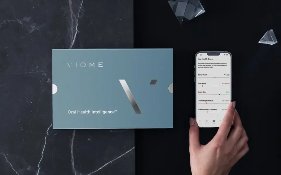 Oral Health Intelligence Test kit beside the Viome app